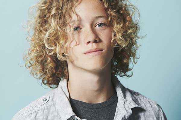Textured hair may require more frequent trims to stay soft and healthy - contact Cutting Crew Hair Salon today for a trim!